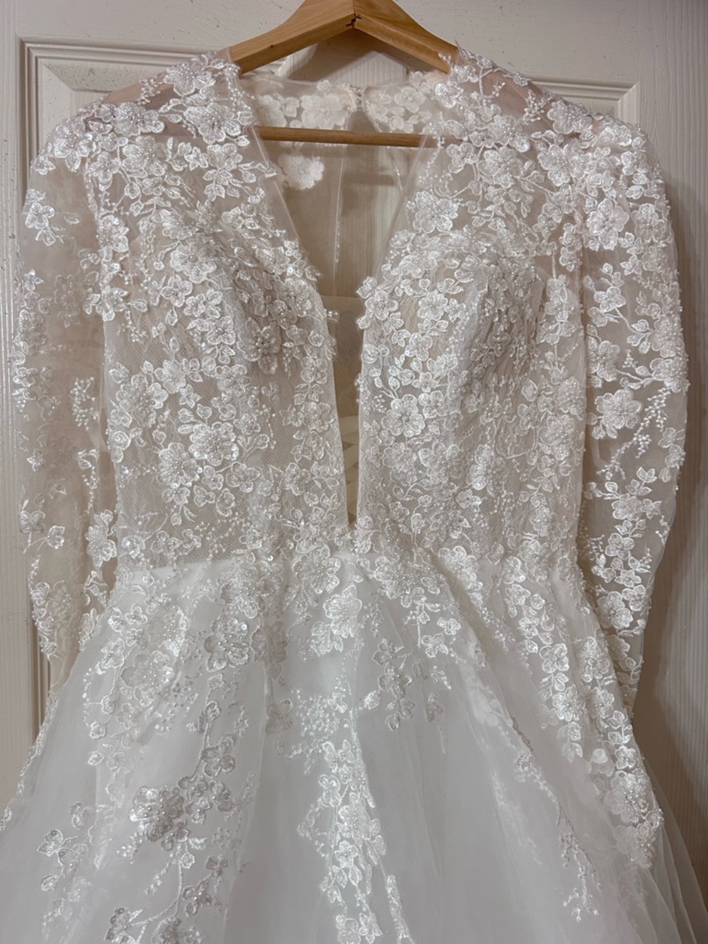 Elegant Long-Sleeve White Lace Wedding Dress with Deep V Bodice